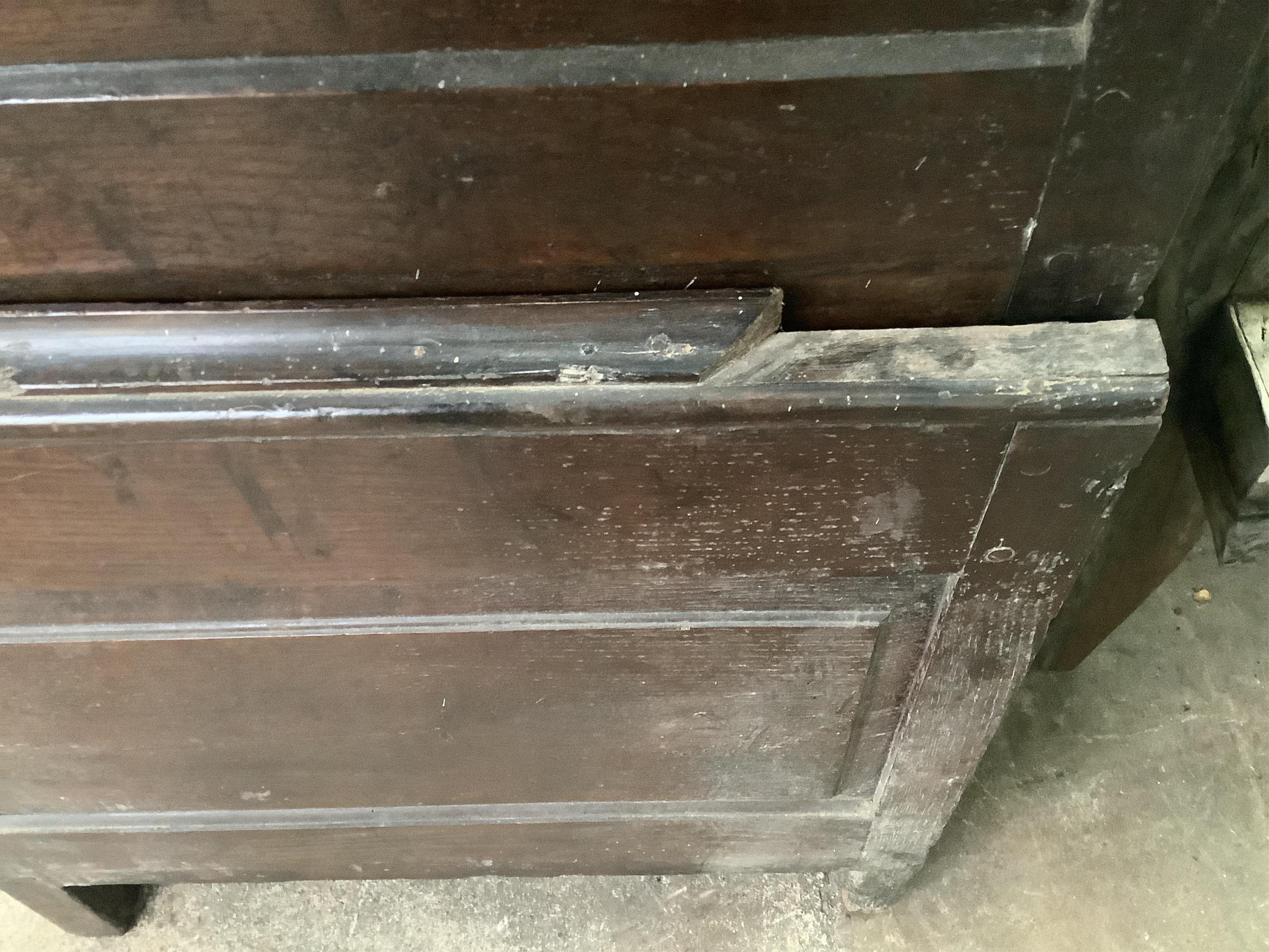 An 18th century panelled oak press cupboard, width 150cm, depth 65cm, height 183cm. Condition - poor to fair